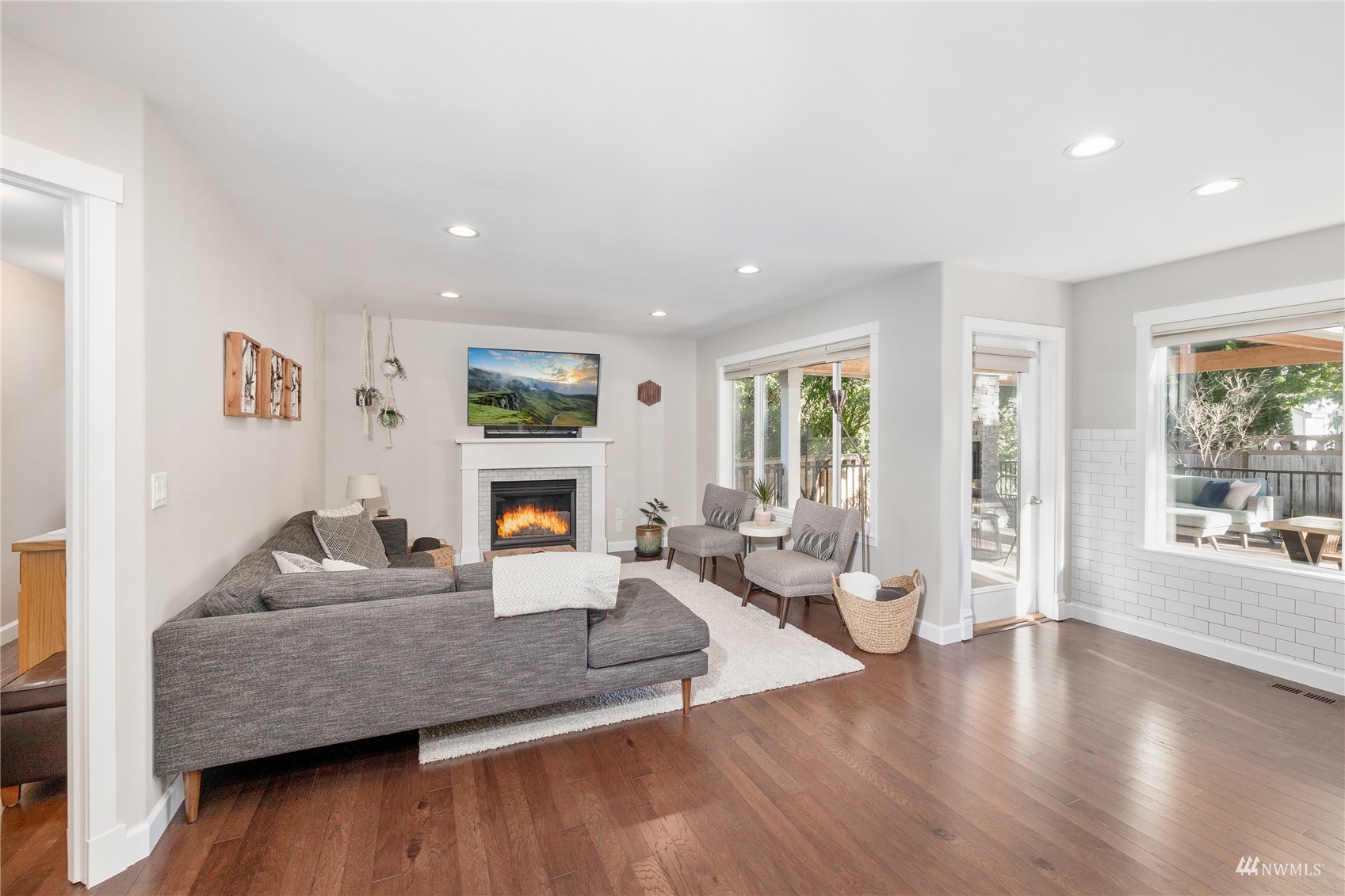 9419 Northeast 175th Street Bothell, WA 98011 - Photo 7 of 28 a living room with furniture and a fireplace