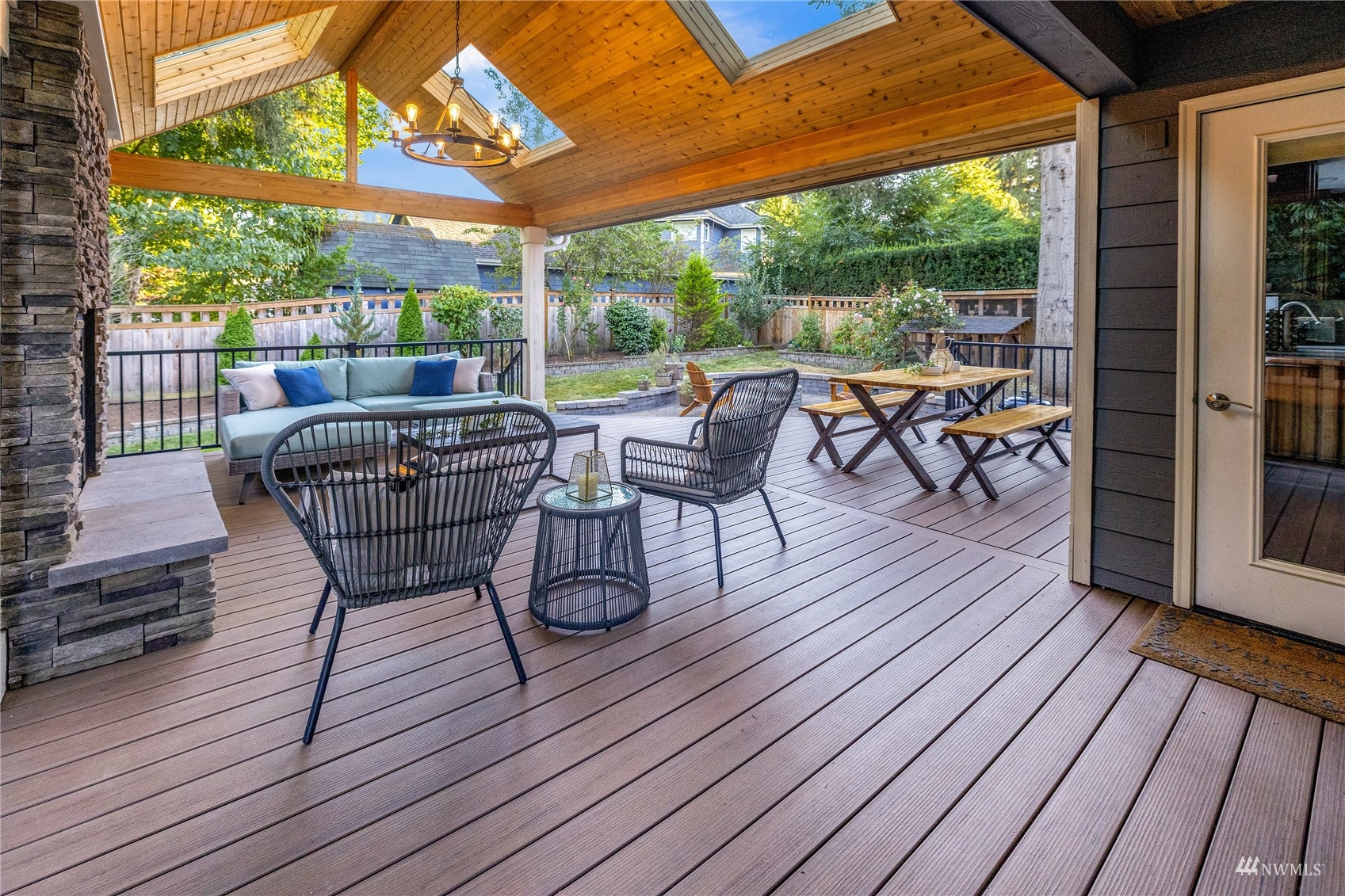 9419 Northeast 175th Street Bothell, WA 98011 - Photo 10 of 28 a view of a patio with table and chairs and wooden floor