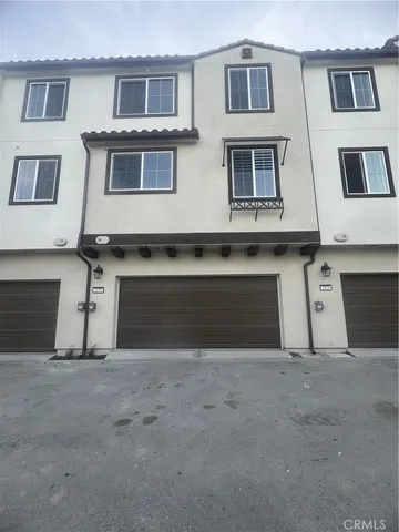 a front view of a house with a garage