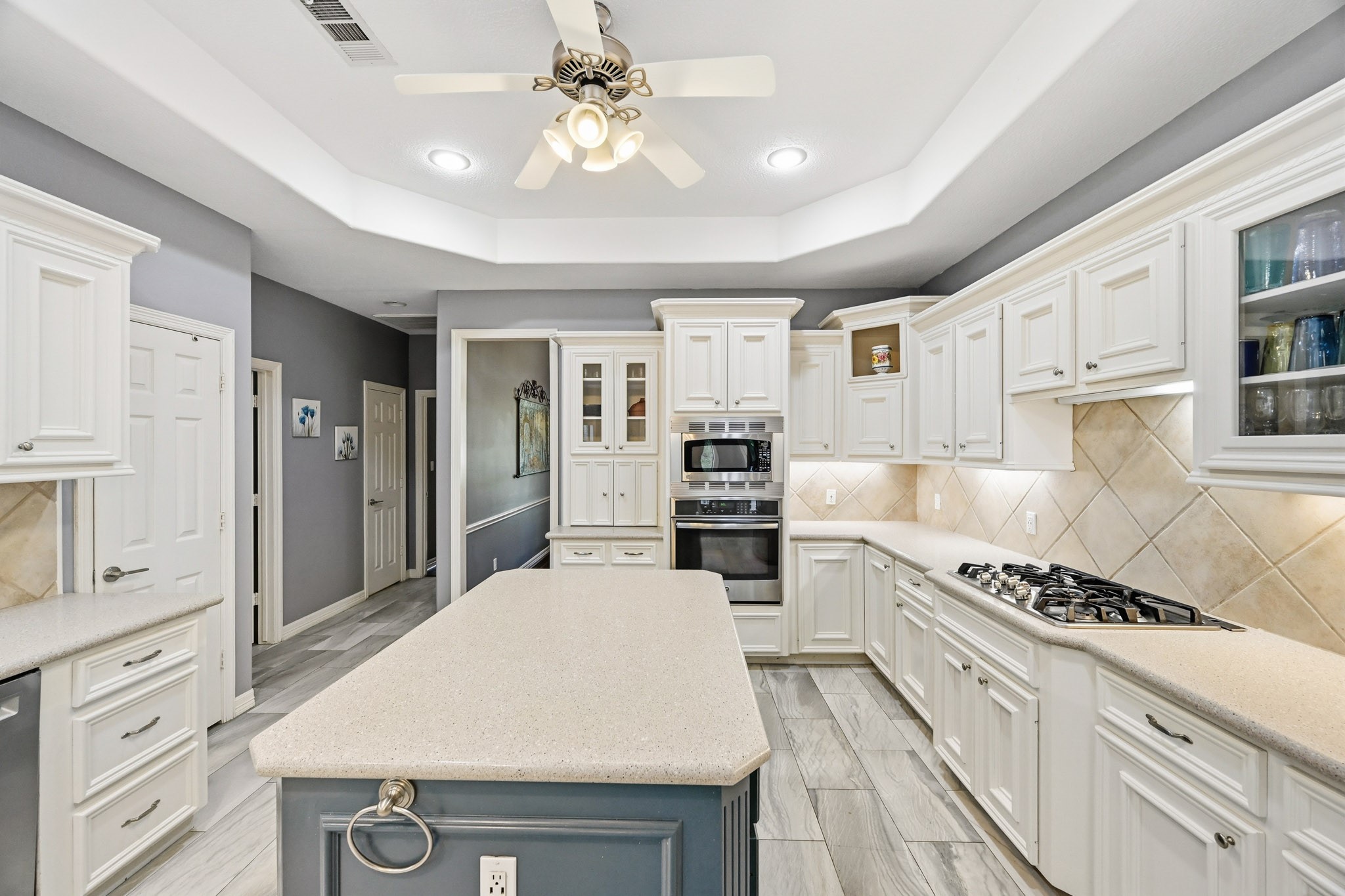 11995 White Oak Crossing Conroe, TX 77385 - Photo 12 of 44 a kitchen with a refrigerator a stove cabinets and living room view