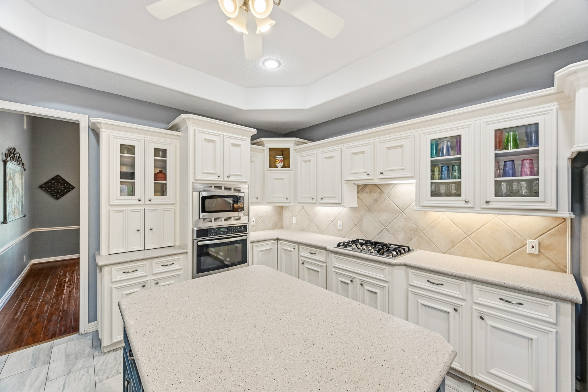 11995 White Oak Crossing Conroe, TX 77385 - Photo 13 of 44 a kitchen with granite countertop cabinets and steel appliances
