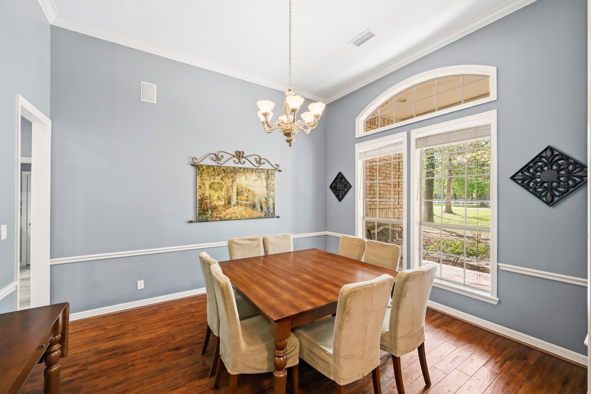 11995 White Oak Crossing Conroe, TX 77385 - Photo 15 of 44 a view of a dining room with furniture window and wooden floor