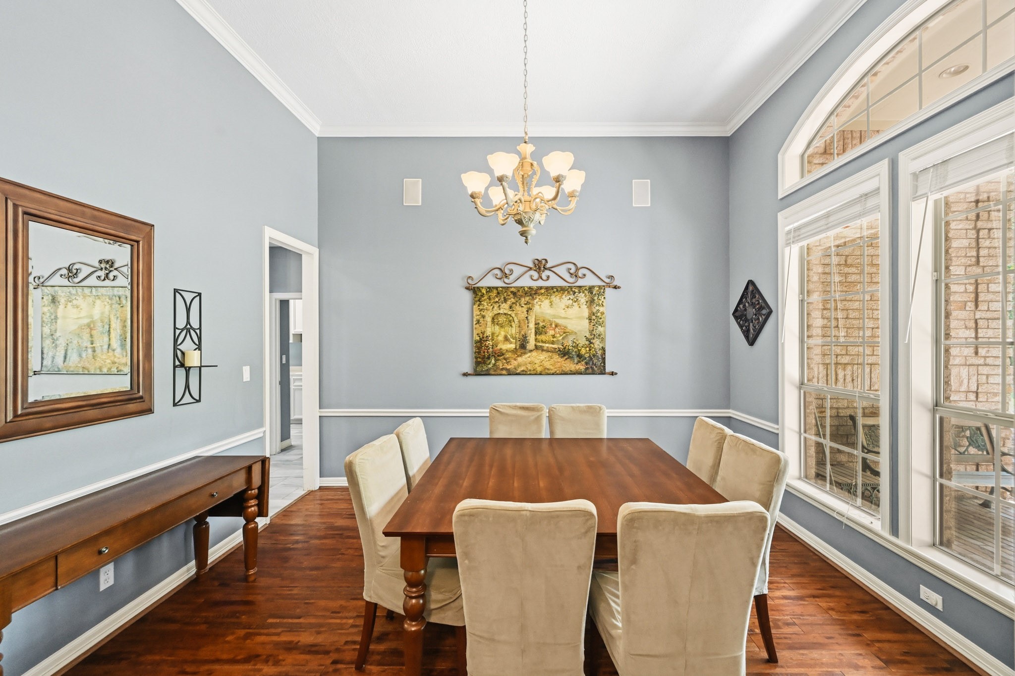 11995 White Oak Crossing Conroe, TX 77385 - Photo 16 of 44 a view of a dining room with furniture a chandelier and wooden floor