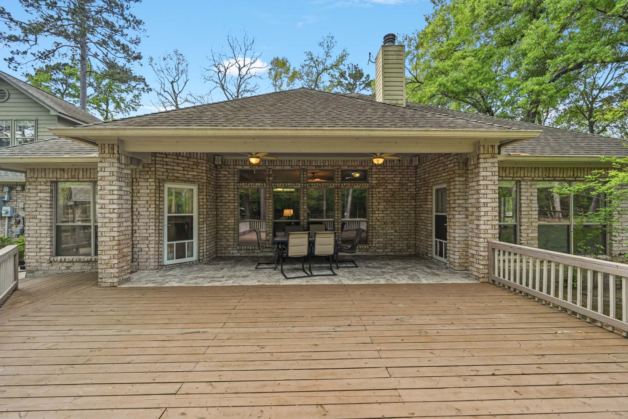 11995 White Oak Crossing Conroe, TX 77385 - Photo 31 of 44 an outdoor view of house with outdoor seating