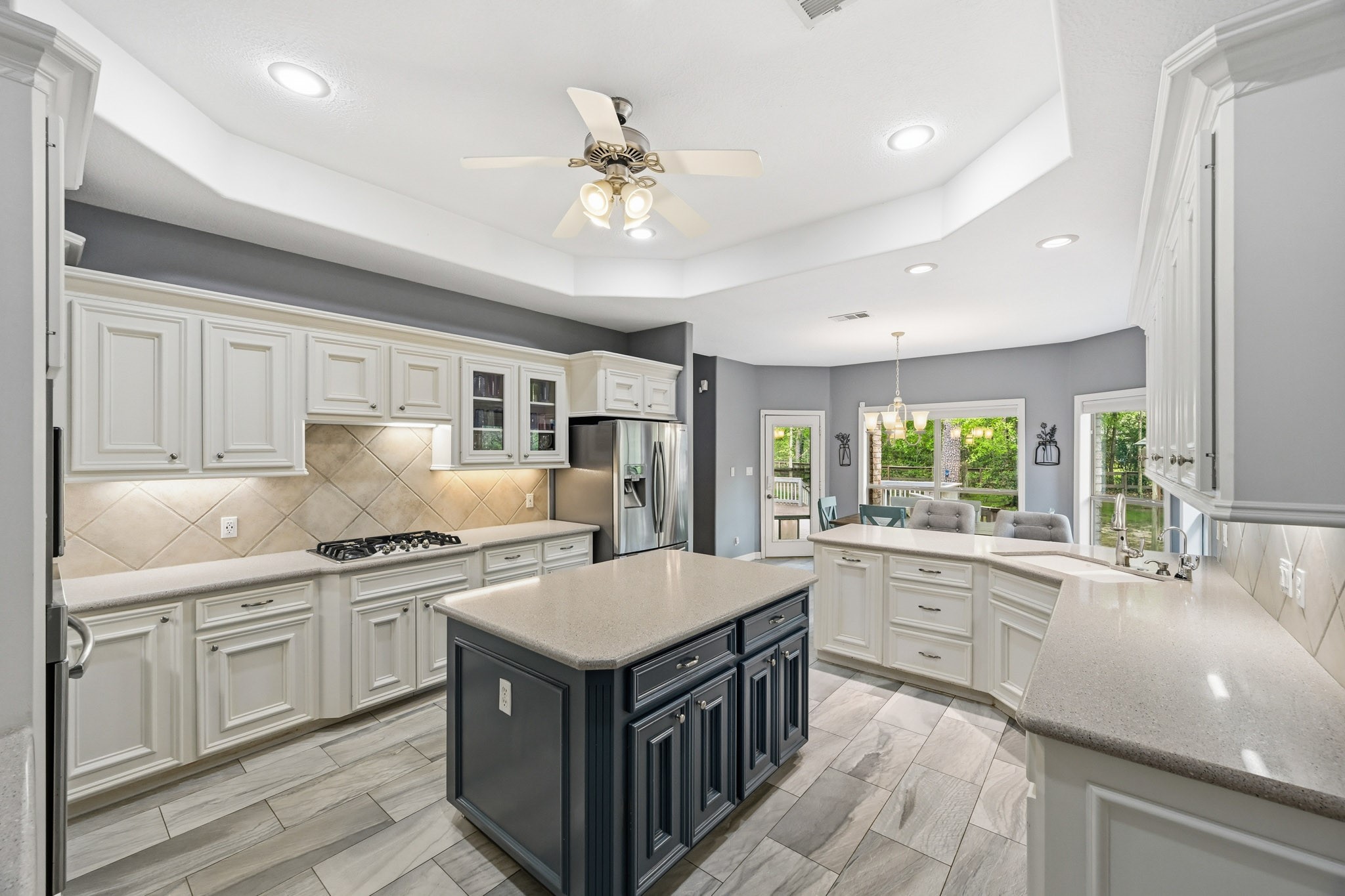 11995 White Oak Crossing Conroe, TX 77385 - Photo 7 of 44 a kitchen with a stove sink and cabinets