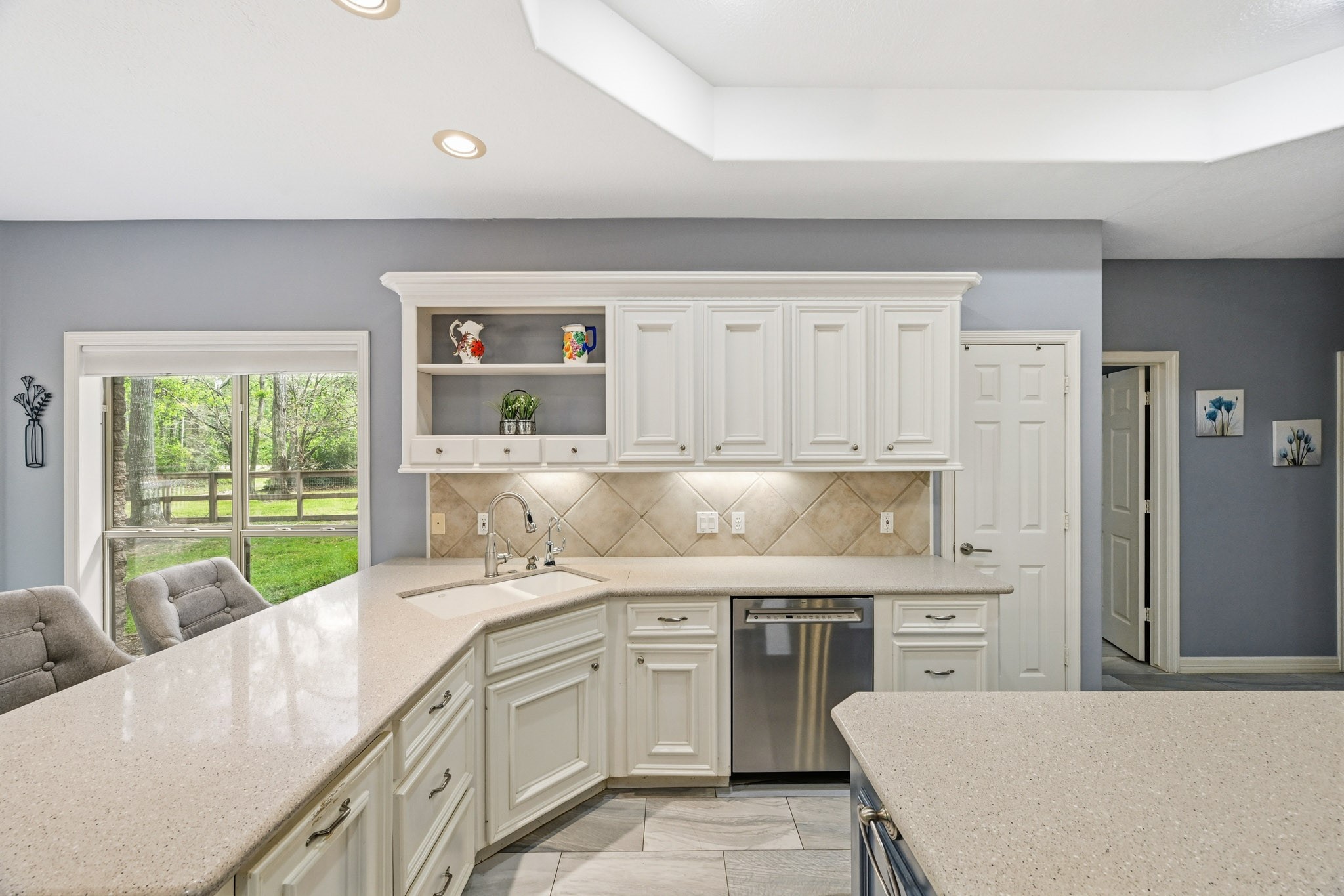 11995 White Oak Crossing Conroe, TX 77385 - Photo 9 of 44 a kitchen with a sink stove and cabinets