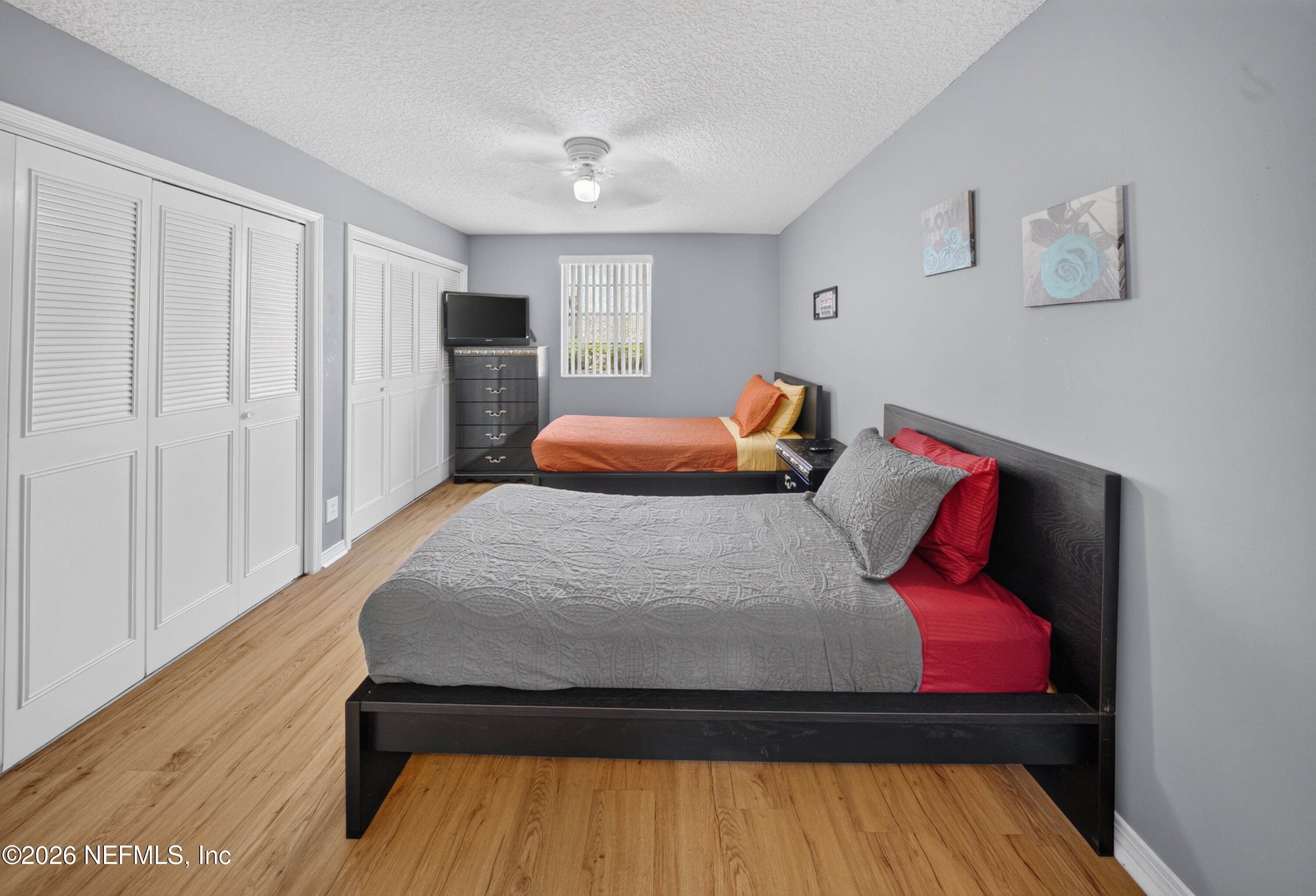 7346 El Barco Road, Unit 4 Jacksonville, FL 32216 - Photo 13 of 19 a bed sitting in a bedroom next to a window