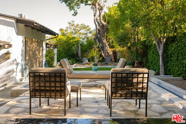 a view of a livingroom with furniture and staircase