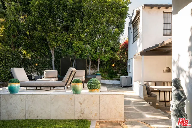 a living room with furniture a window and a rug