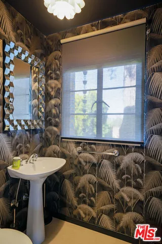 a view of a workspace with furniture and gym equipment