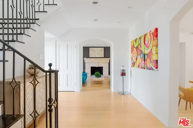 a room with furniture projector and screen