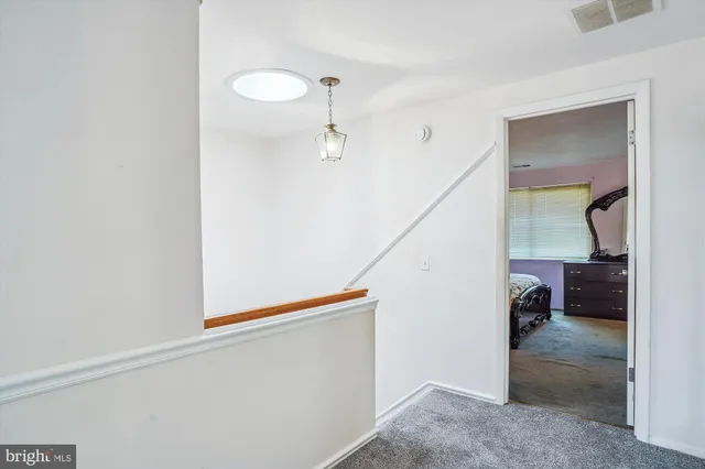 a bathroom with a sink vanity mirror and tub