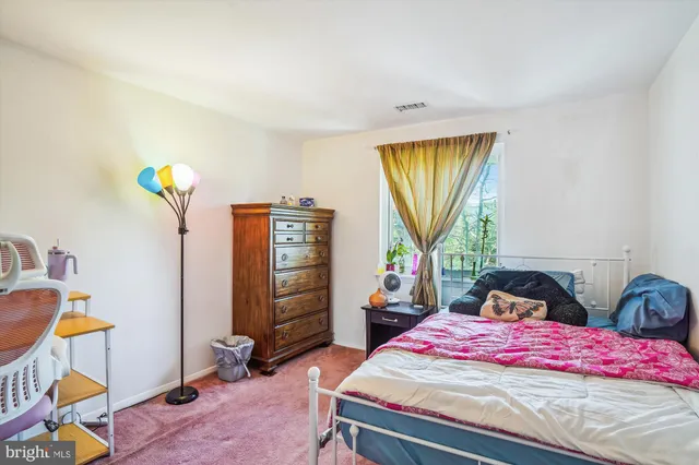 a living room with lots of furniture and books