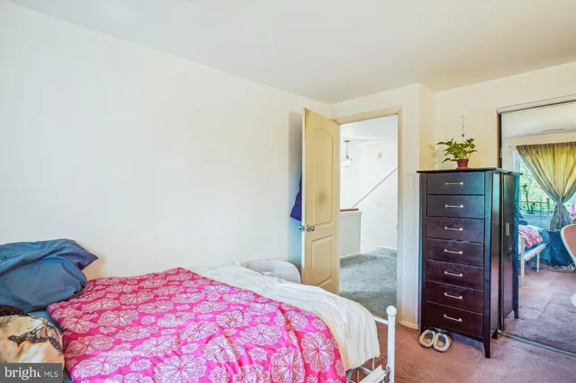 a view of a dining room with furniture and a potted plant