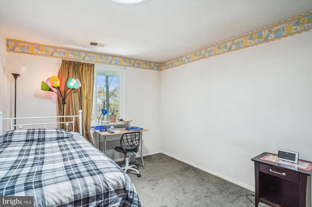 a living room with lots of gym equipment