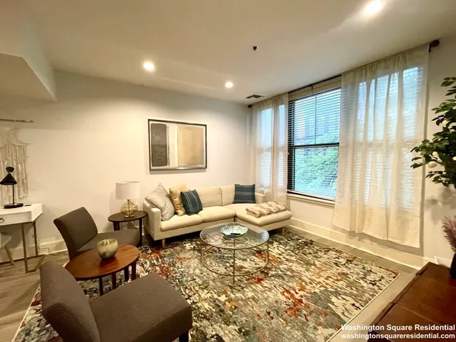 a bedroom with a bed and flat screen tv