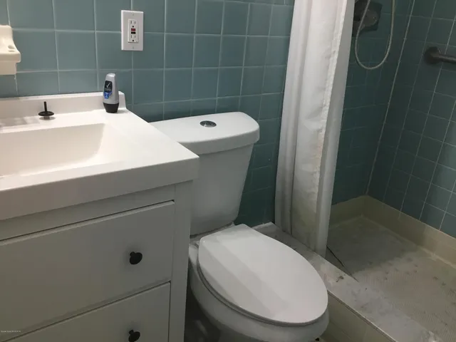 a large bed sitting next to a window