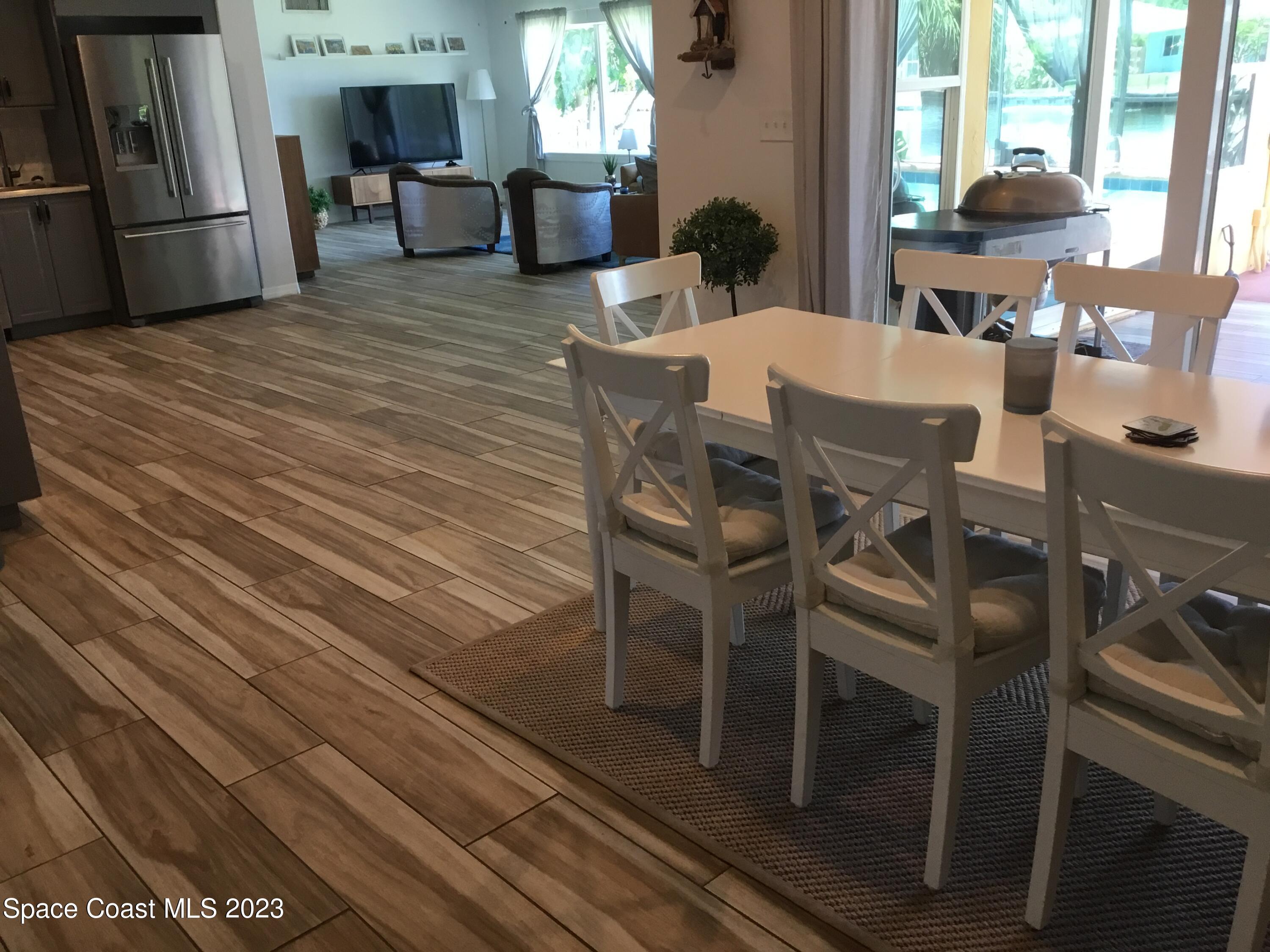 453 Capri Road Cocoa Beach, FL 32931 - Photo 25 of 30 a view of a dining room with furniture