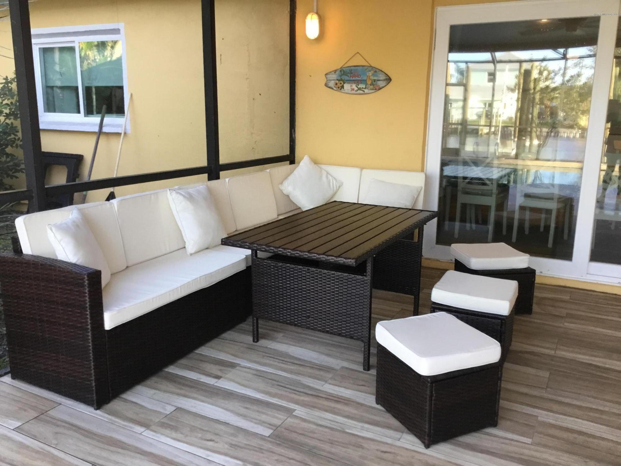 453 Capri Road Cocoa Beach, FL 32931 - Photo 5 of 30 a bedroom with a bed and a dresser next to a window