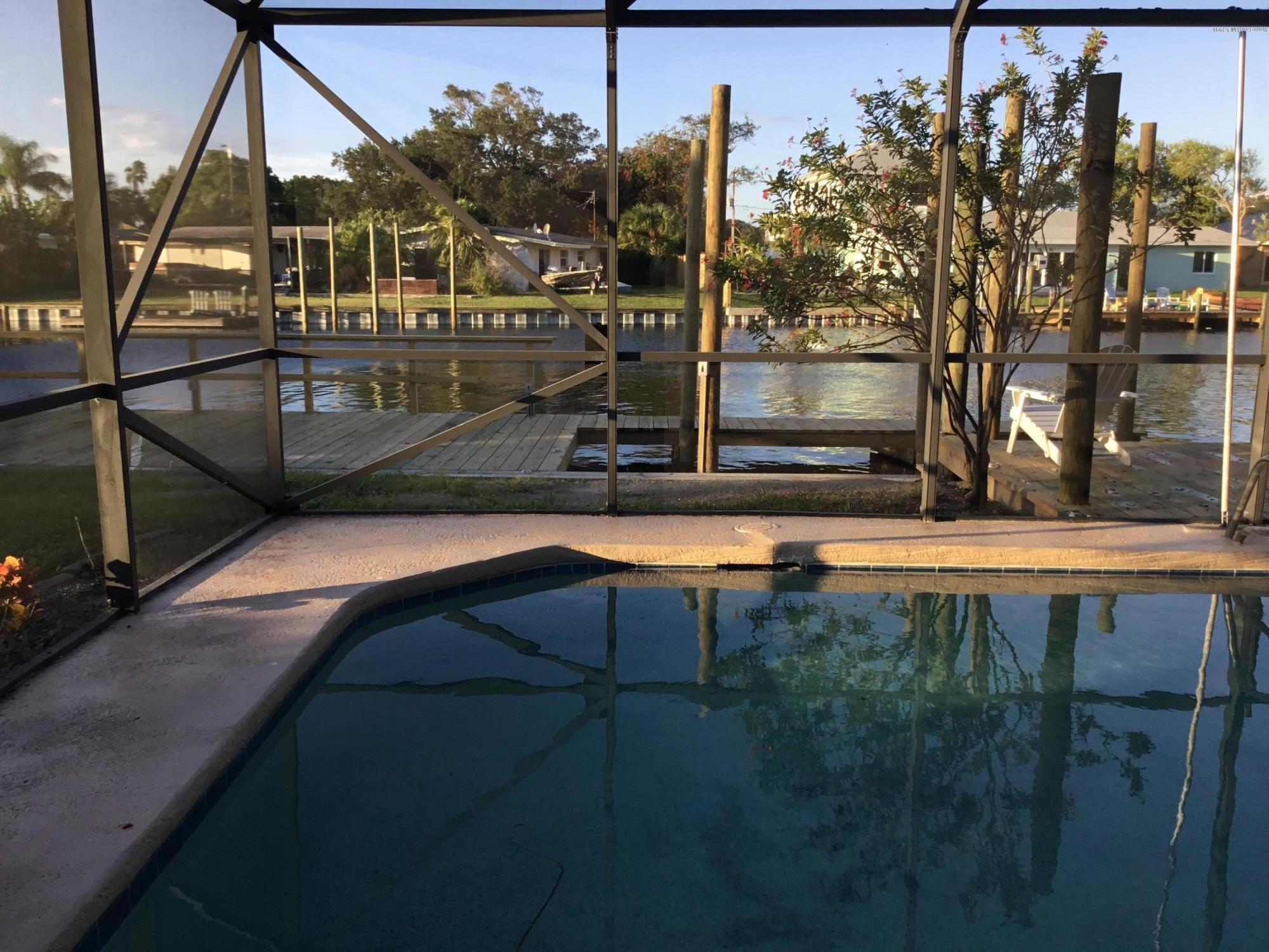453 Capri Road Cocoa Beach, FL 32931 - Photo 7 of 30 a view of outdoor space and swimming pool