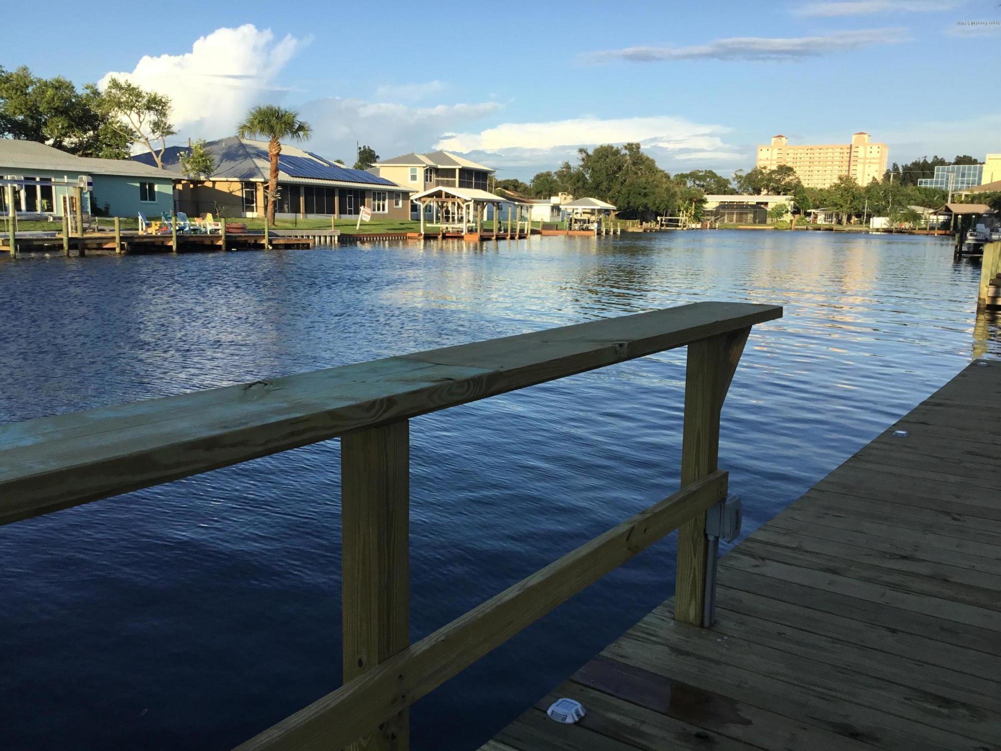 453 Capri Road Cocoa Beach, FL 32931 - Photo 8 of 30 a view of a lake from a balcony