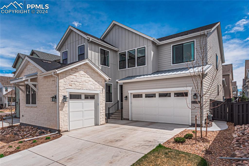 a front view of a house with a garage