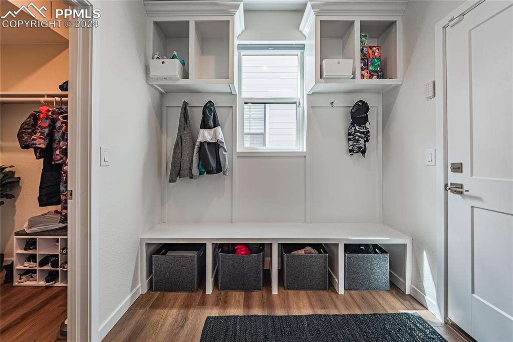 11148 Cloud Shadow Road Littleton, CO 80125 - Photo 13 of 46 a view of hallway with furniture and wooden floor