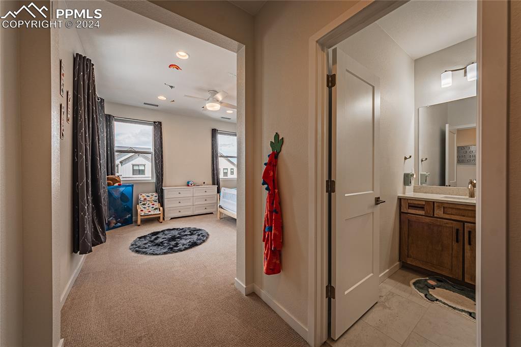 11148 Cloud Shadow Road Littleton, CO 80125 - Photo 20 of 46 a view of a kitchen from the hallway