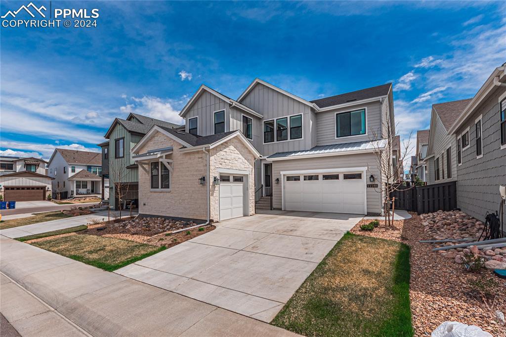 11148 Cloud Shadow Road Littleton, CO 80125 - Photo 2 of 46 a front view of a house with yard