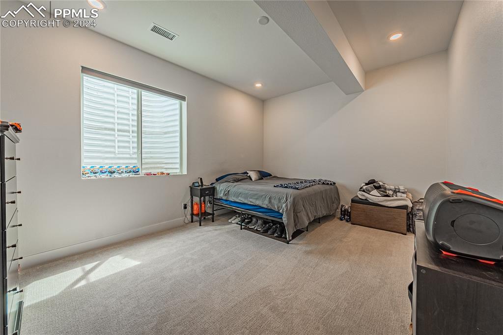 11148 Cloud Shadow Road Littleton, CO 80125 - Photo 41 of 46 a bedroom with bed and a window