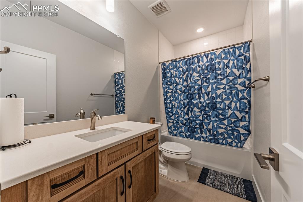 11148 Cloud Shadow Road Littleton, CO 80125 - Photo 42 of 46 a bathroom with a sink toilet and shower