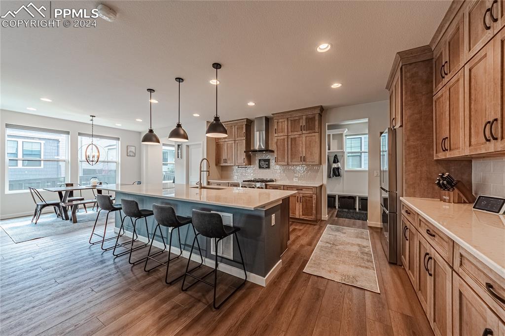 11148 Cloud Shadow Road Littleton, CO 80125 - Photo 6 of 46 a large kitchen with lots of counter space and stainless steel appliances