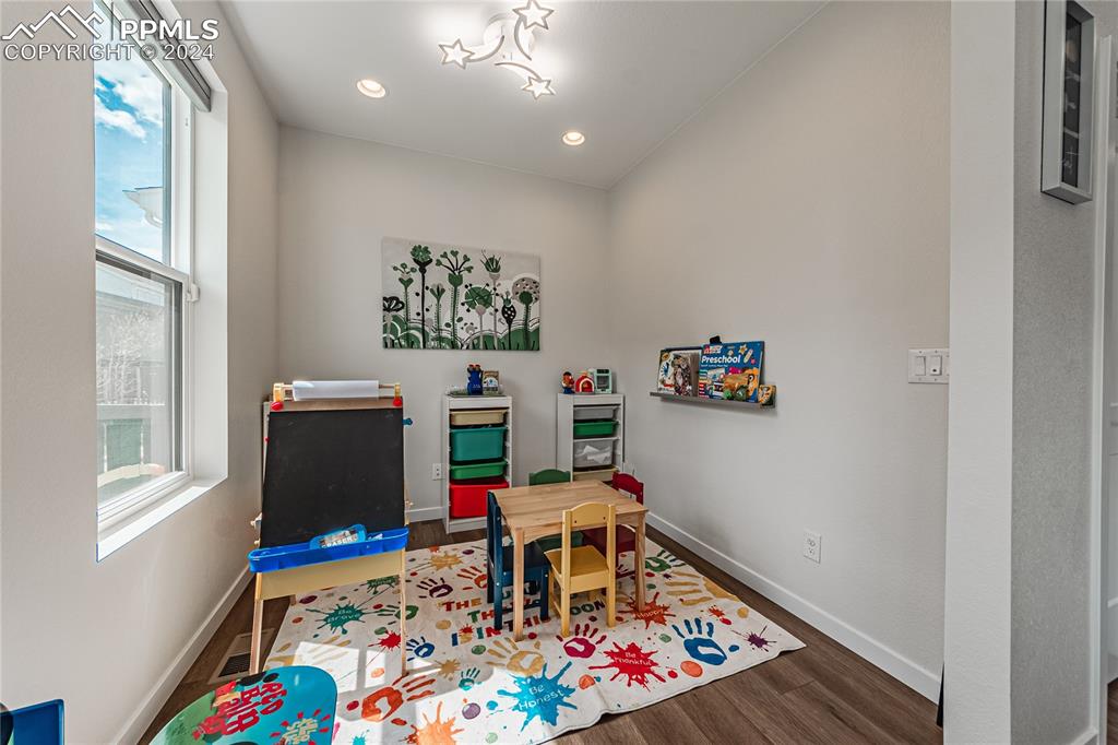 11148 Cloud Shadow Road Littleton, CO 80125 - Photo 10 of 46 a room with toys and a wooden floor
