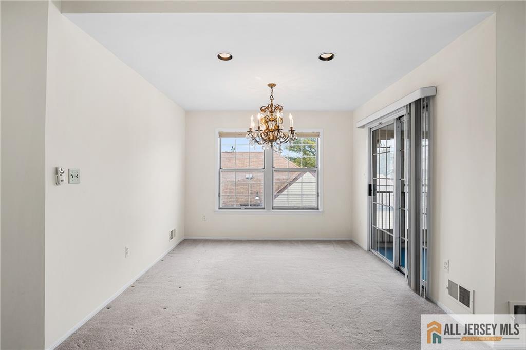 11A Rothwell Drive, Unit 11D Monroe Township, NJ 08831 - Photo 12 of 43 a view of an empty room with a window