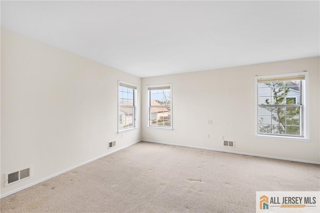 11A Rothwell Drive, Unit 11D Monroe Township, NJ 08831 - Photo 17 of 43 an empty room with windows