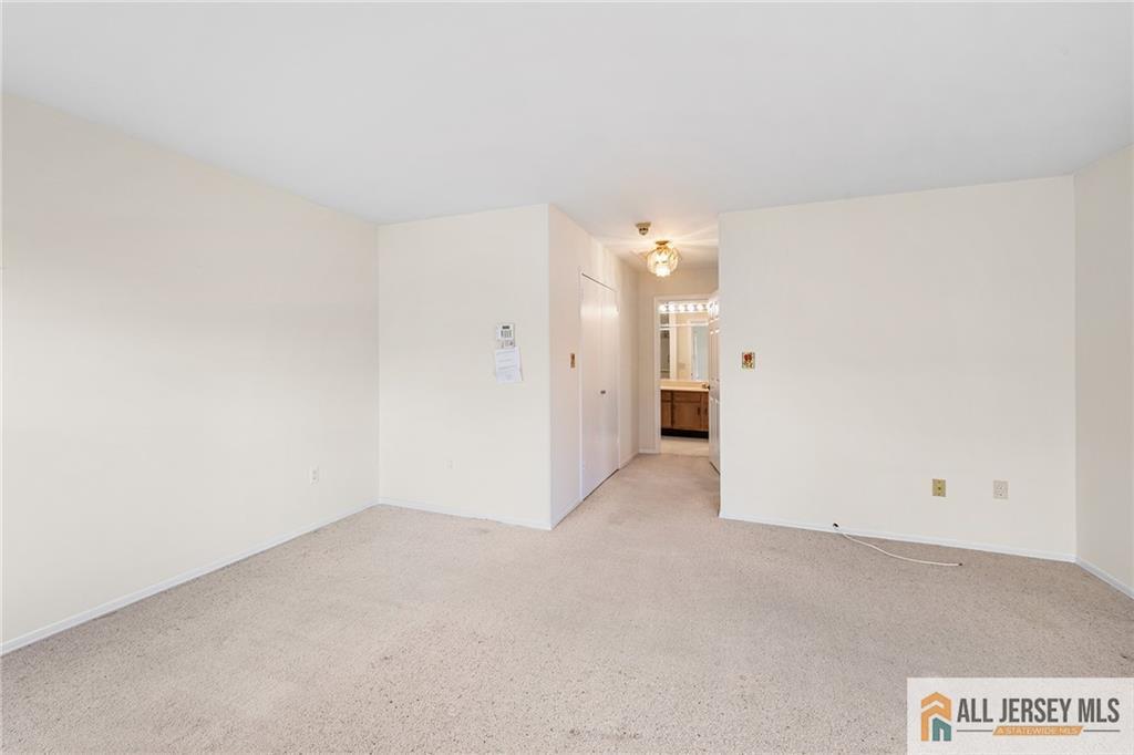 11A Rothwell Drive, Unit 11D Monroe Township, NJ 08831 - Photo 19 of 43 a view of an empty room