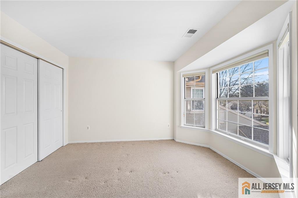11A Rothwell Drive, Unit 11D Monroe Township, NJ 08831 - Photo 25 of 43 a view of an empty room with a window