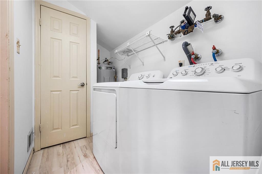 11A Rothwell Drive, Unit 11D Monroe Township, NJ 08831 - Photo 29 of 43 a bathroom with a sink and mirror