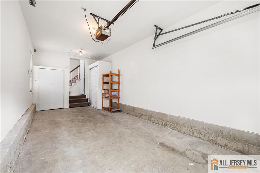 11A Rothwell Drive, Unit 11D Monroe Township, NJ 08831 - Photo 31 of 43 an empty room with a ceiling fan and stairs