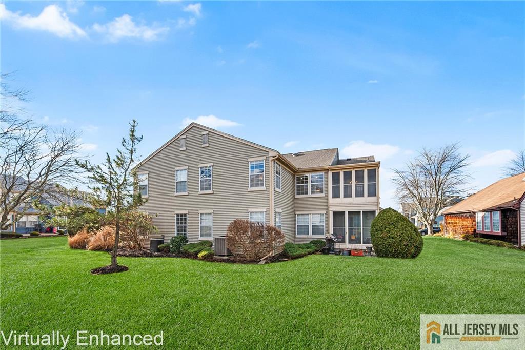11A Rothwell Drive, Unit 11D Monroe Township, NJ 08831 - Photo 32 of 43 a view of a house with a yard
