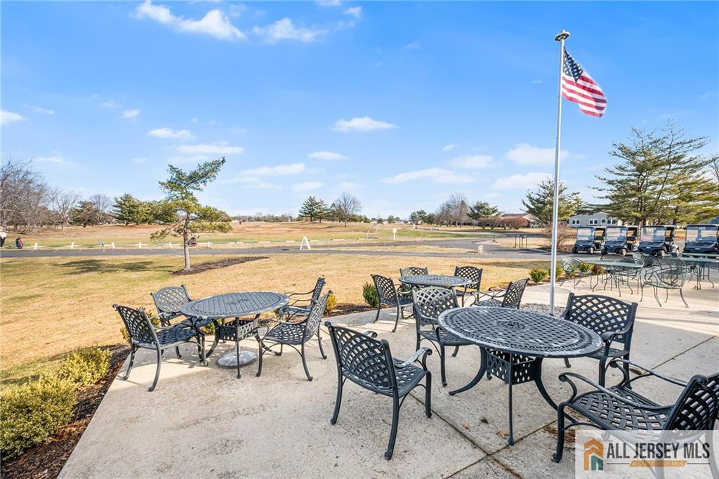 11A Rothwell Drive, Unit 11D Monroe Township, NJ 08831 - Photo 42 of 43 a view of a terrace with furniture and city view