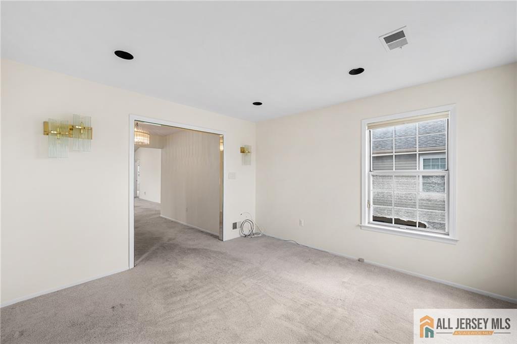 11A Rothwell Drive, Unit 11D Monroe Township, NJ 08831 - Photo 8 of 43 an empty room with windows