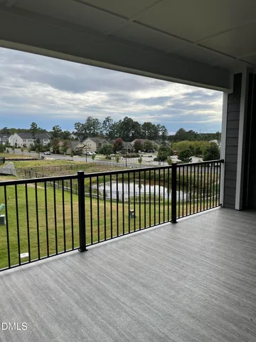 a large kitchen with kitchen island a large island in the center and stainless steel appliances