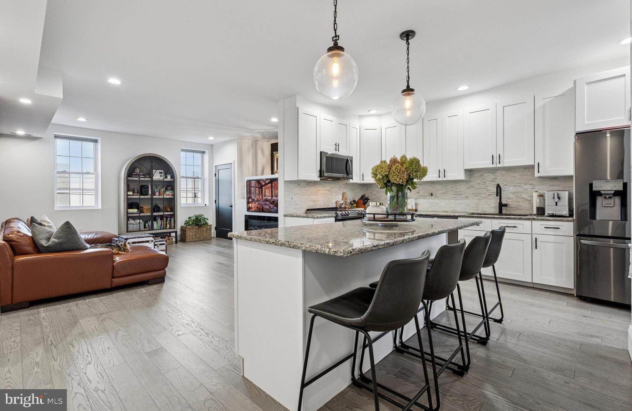 2694 Bridge Street Philadelphia, PA 19137 - Photo 8 of 41 a open kitchen with stainless steel appliances granite countertop a stove and refrigerator