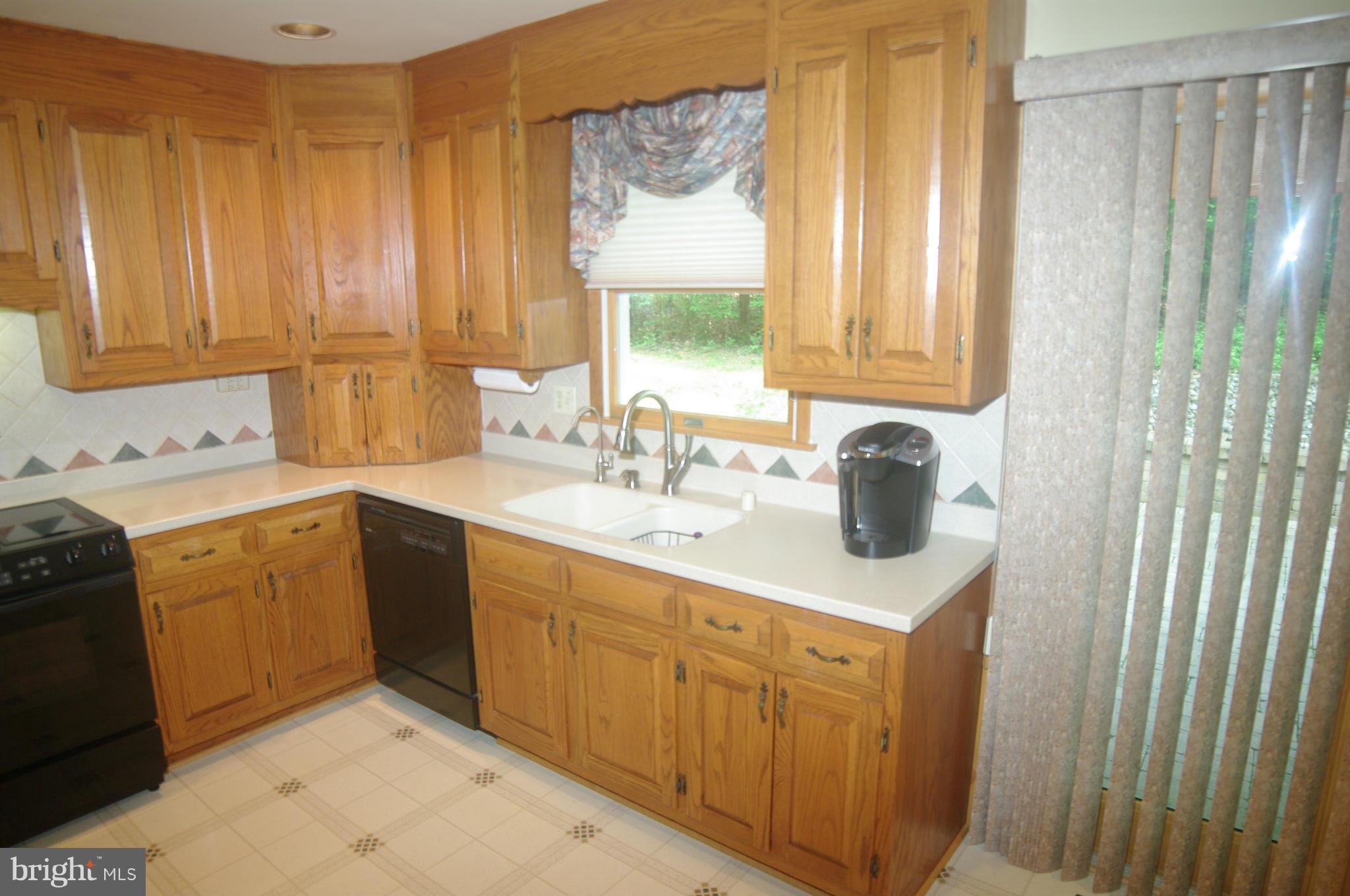 2619 Bachman Road Westminster, MD 21157 - Photo 16 of 30 Corian counters with seamless backsplash