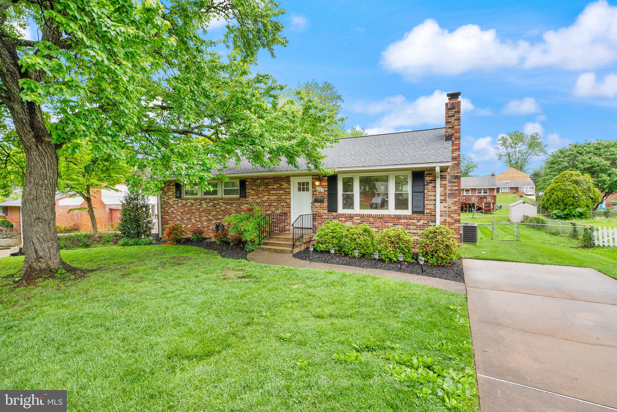 5301 Nutting Drive Springfield, VA 22151 - Photo 1 of 43 a front view of a house with garden