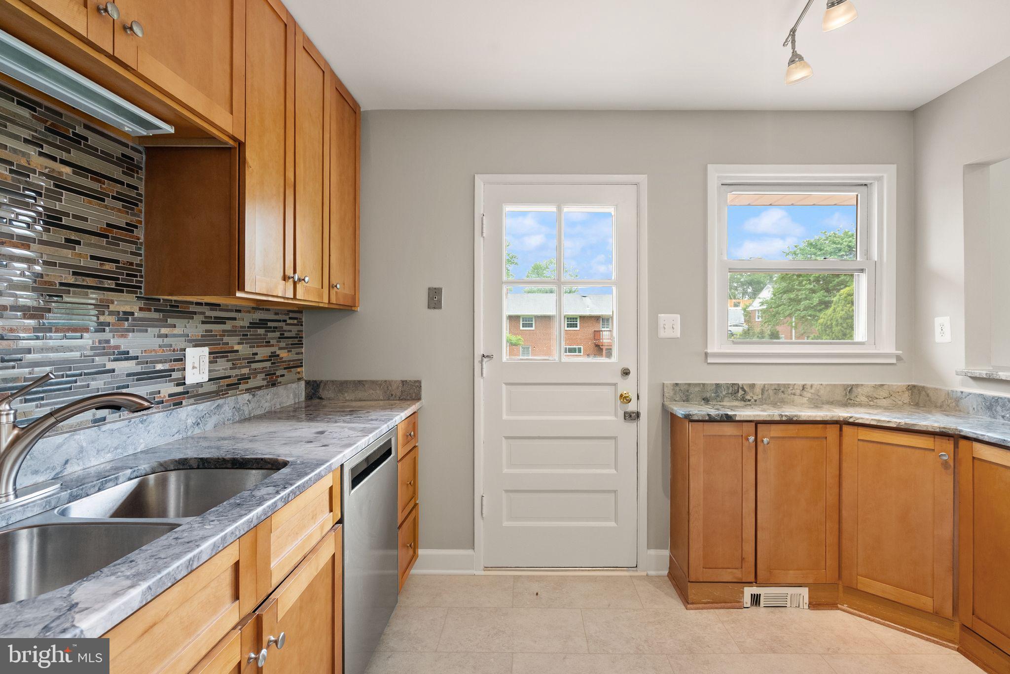 5301 Nutting Drive Springfield, VA 22151 - Photo 17 of 43 a kitchen that has a sink and a stove