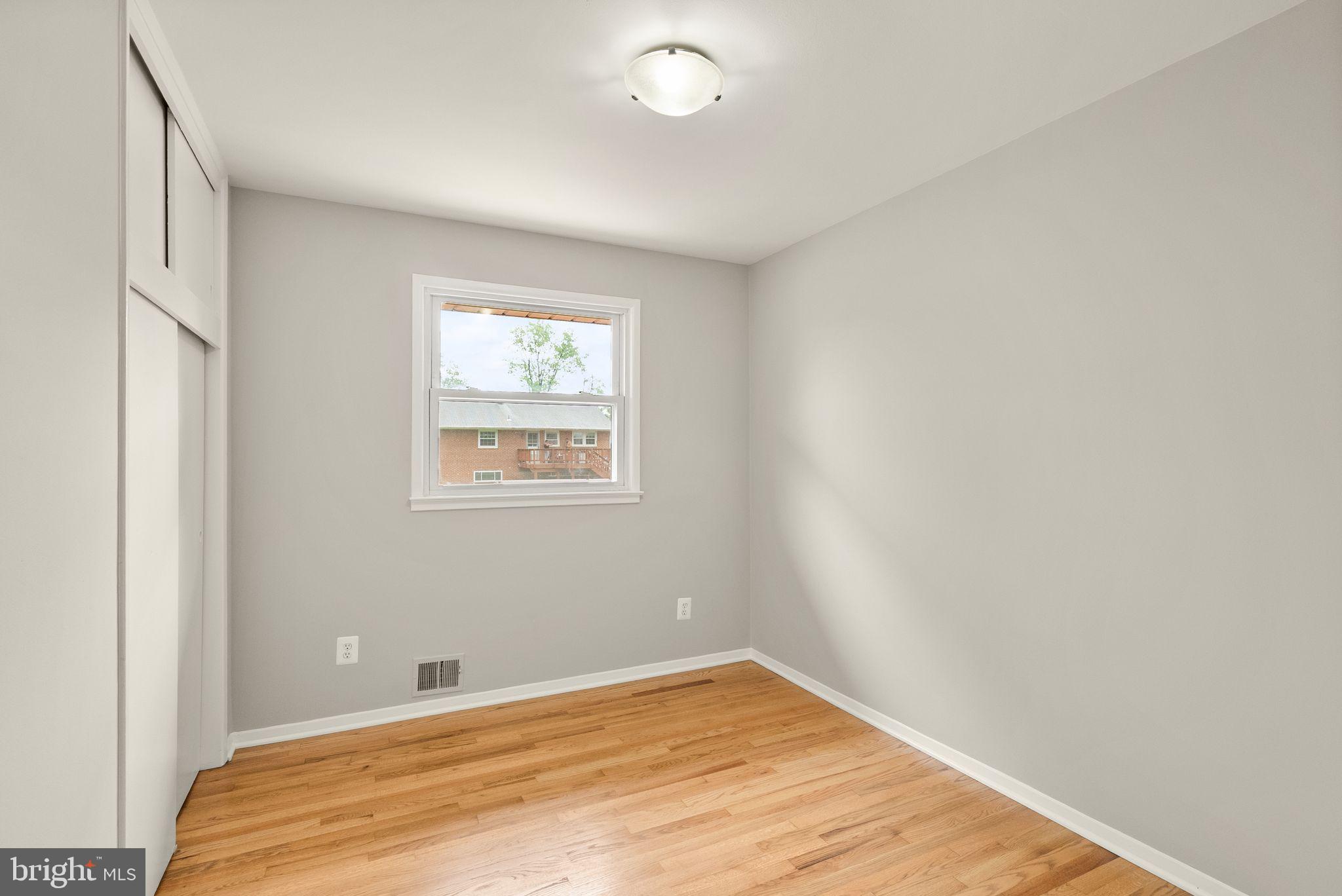 5301 Nutting Drive Springfield, VA 22151 - Photo 24 of 43 a view of a room with wooden floor and a window