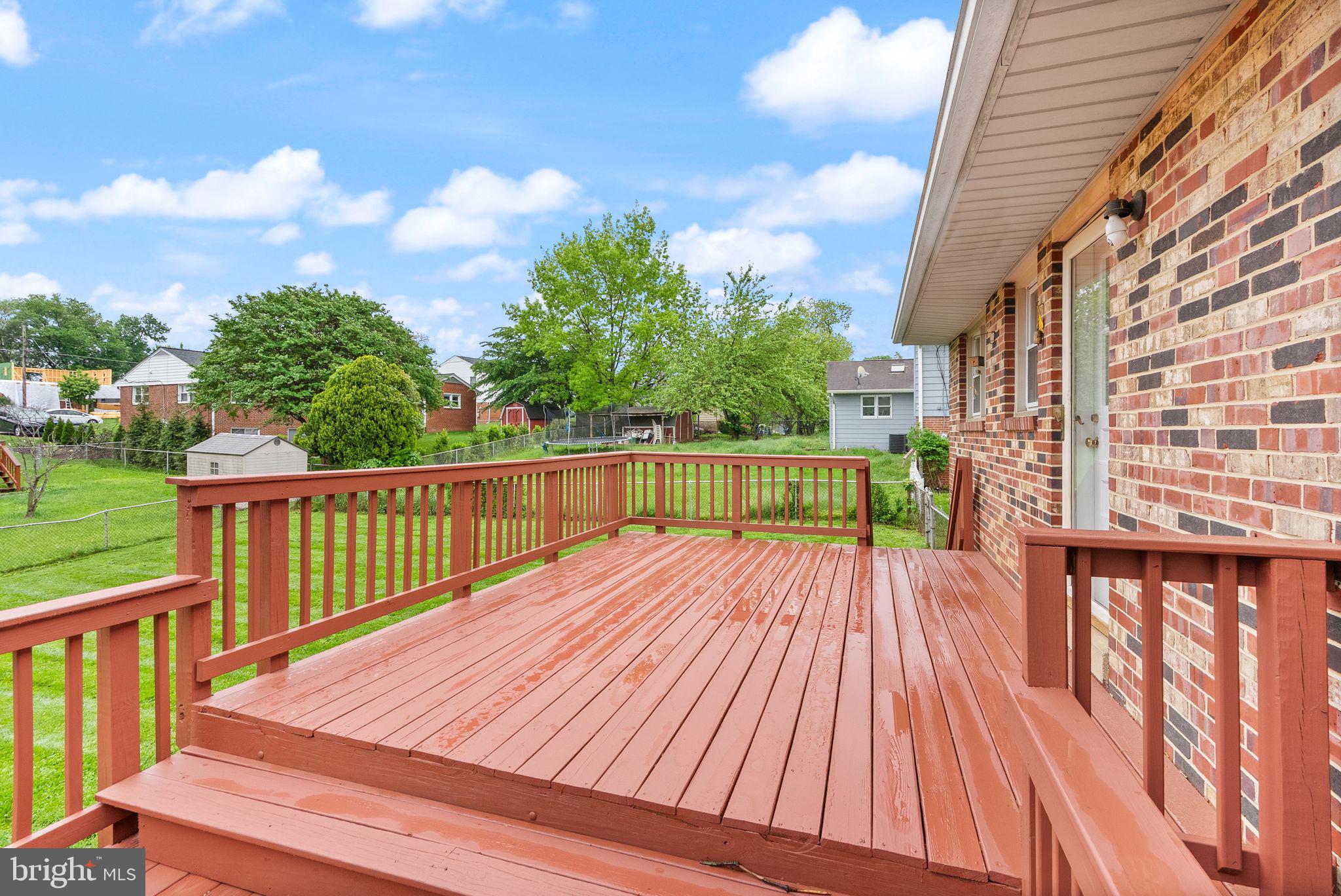 5301 Nutting Drive Springfield, VA 22151 - Photo 40 of 43 a view of balcony with wooden floor and fence