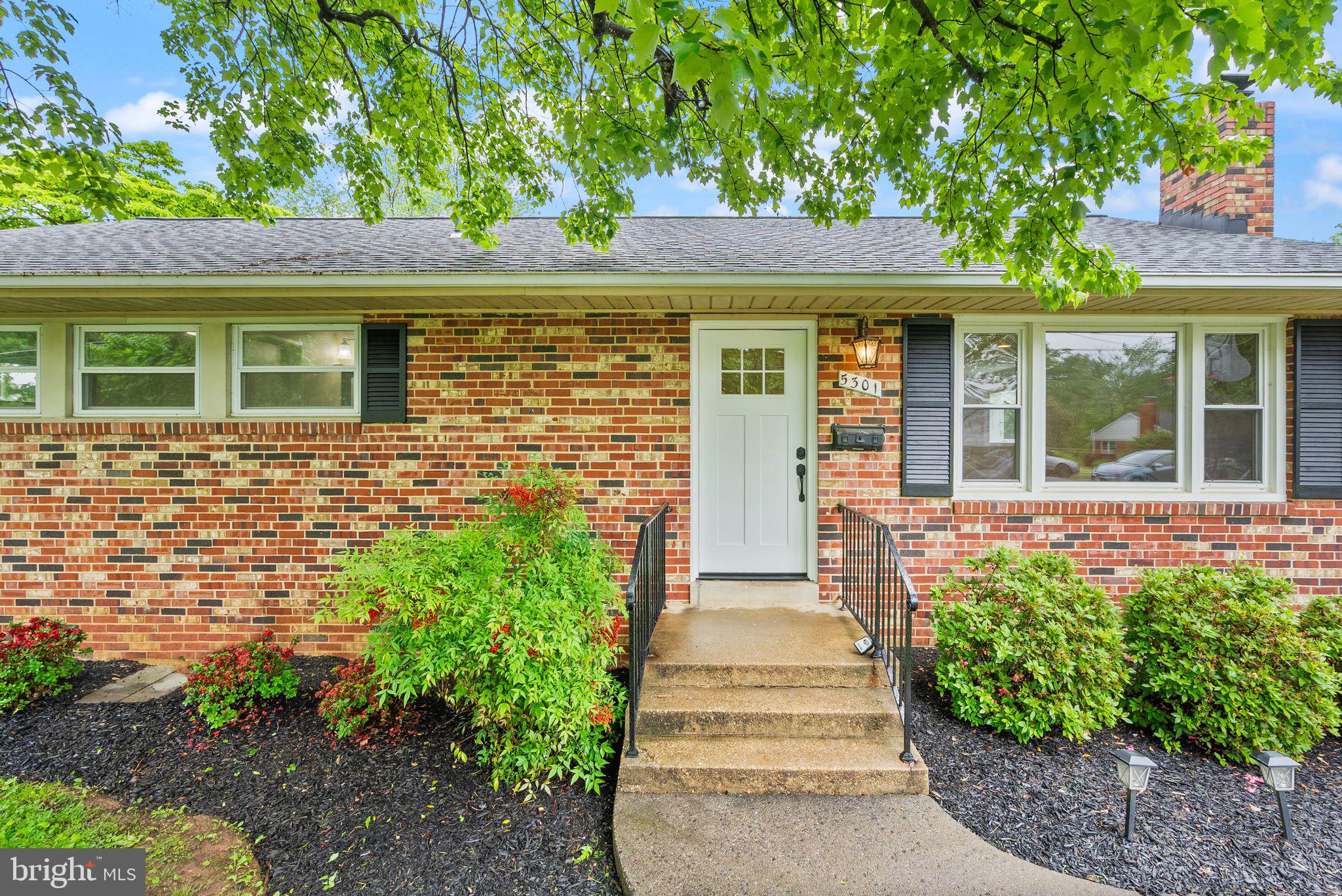 5301 Nutting Drive Springfield, VA 22151 - Photo 8 of 43 a front view of a house with a garden